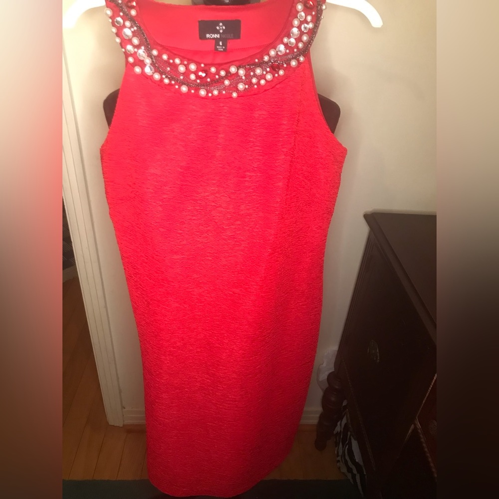 Red dress by Ronni Nicole. Size 6. 23’ long.